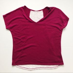 Magenta T-shirt with lace detail in the back.